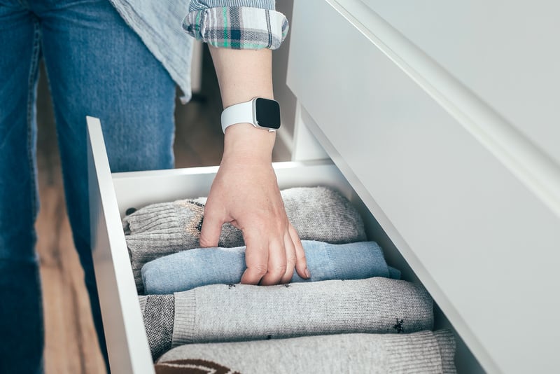 Person  Organizing Stuff in Drawer