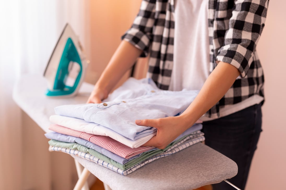 Woman folding clean clothes